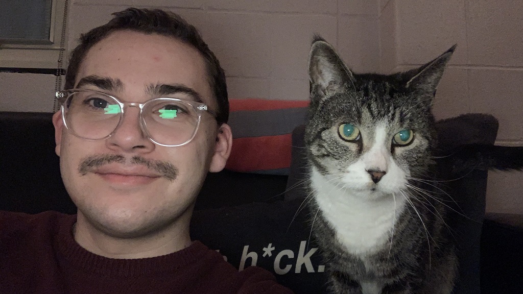 JWU student in dorm with cat