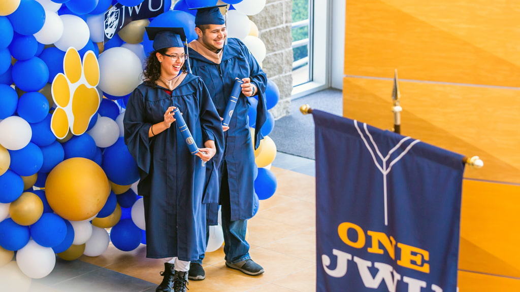 Photo op during the 2021 Grad Walk. Photo: Mike Cohea