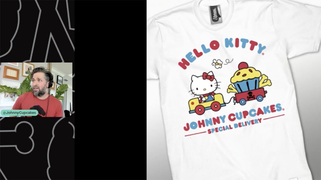 Screenshot from Johnny Cupcakes panel. Johnny shows image of a Johnny Cupcakes x Hello Kitty collab shirt.