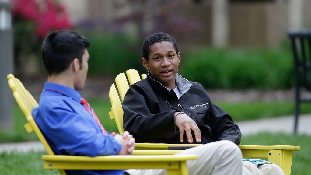 Students sitting in Charlotte quad talking