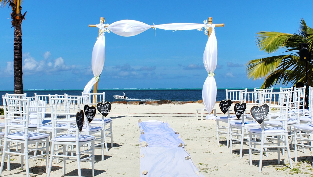 Wedding on beach with focal point arch
