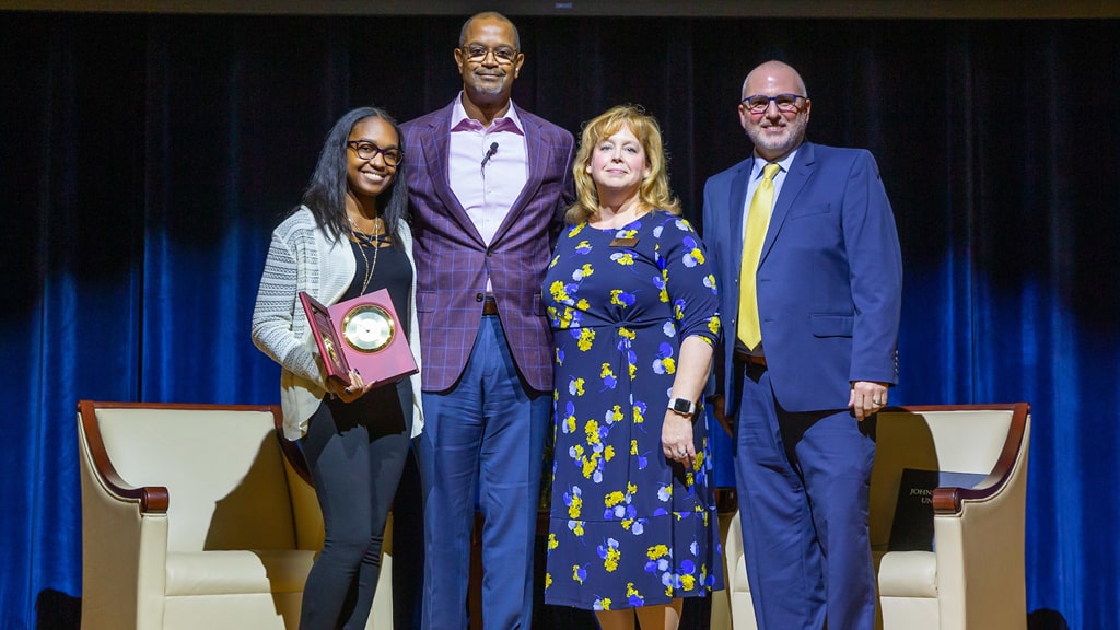 VIP Scholarship Winner Kayla Gayle '22, VIP speaker Chip Wade  '83, '86 Hon., Interim Dean Jennifer Galipeau, Richard Wiscott