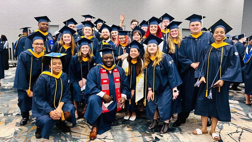 Group shot of new grads at Charlotte Commencement.