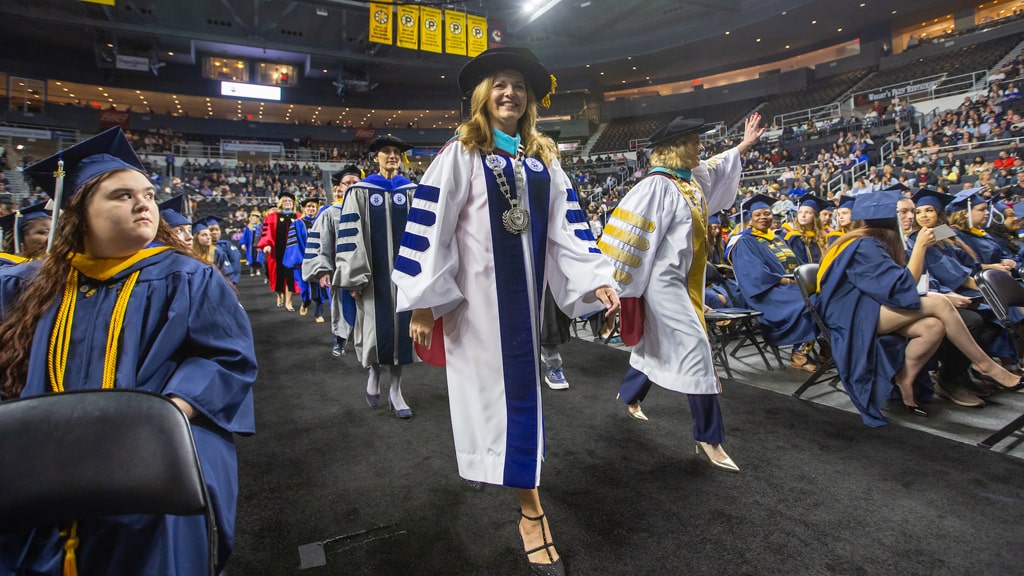 Chancellor Runey and Providence Campus President Bernardo-Sousa lead the processional during Commencement. 