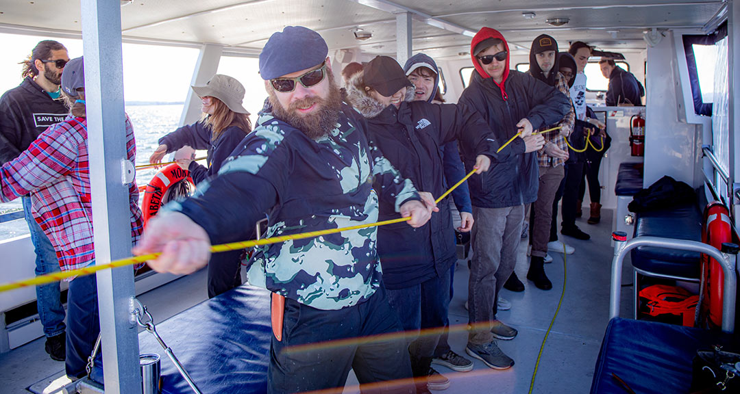 Sustainable Food Systems students working together to pull on a rope