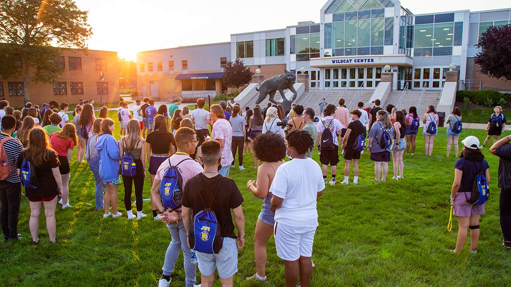 Students gathered on the Harborside Greenspace in front of the Wildcat Center for Summer Orientation 