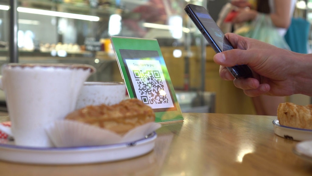 Customer scans a QR code at a restaurant