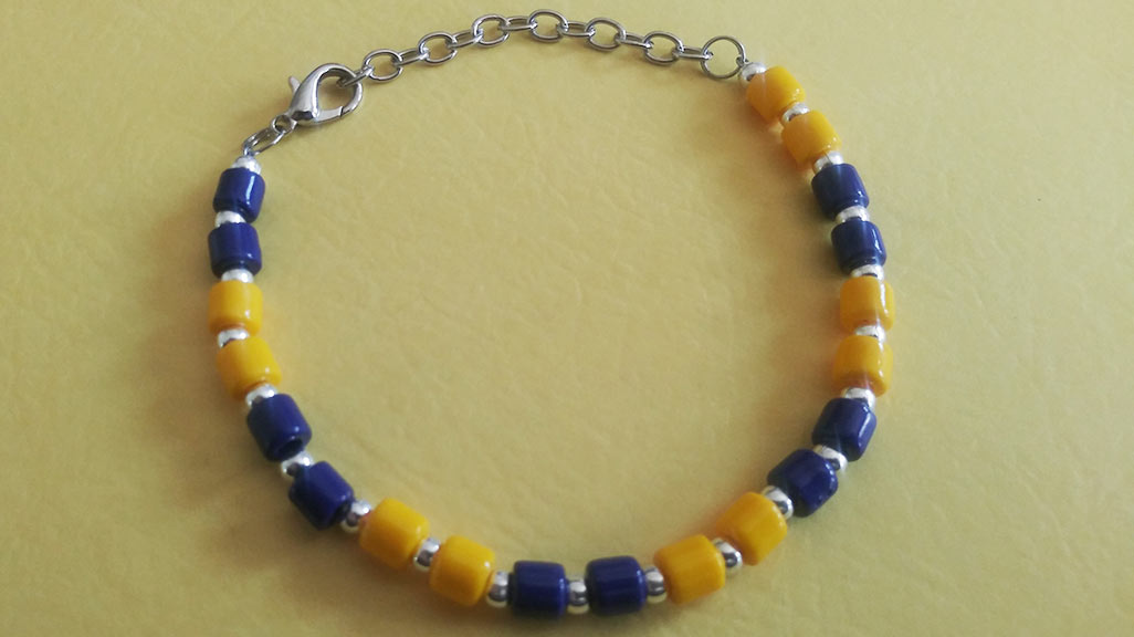 One of the blue and yellow bracelets sold at JWU Charlotte in support of Ukraine