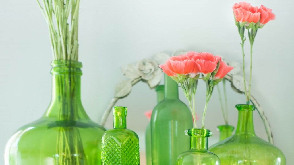 flowers in green bottles