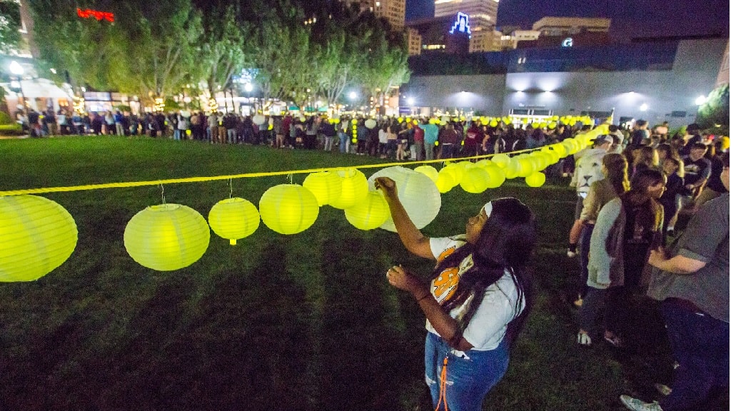 JWU student hanging a lantern