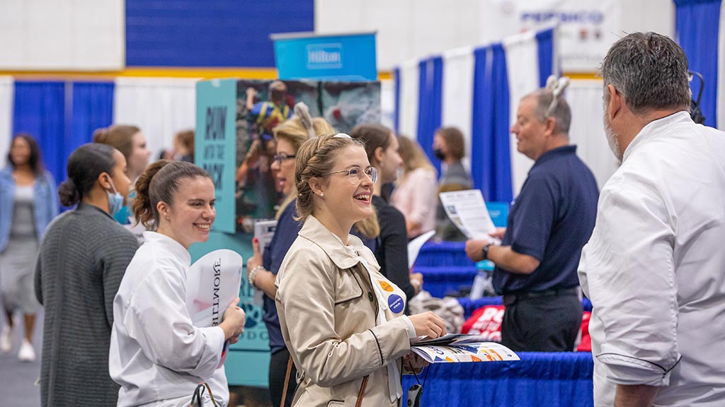 a candid capture of JWU students at a career fair