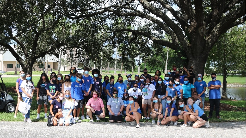 a group of people taking a picture for hello hygienics