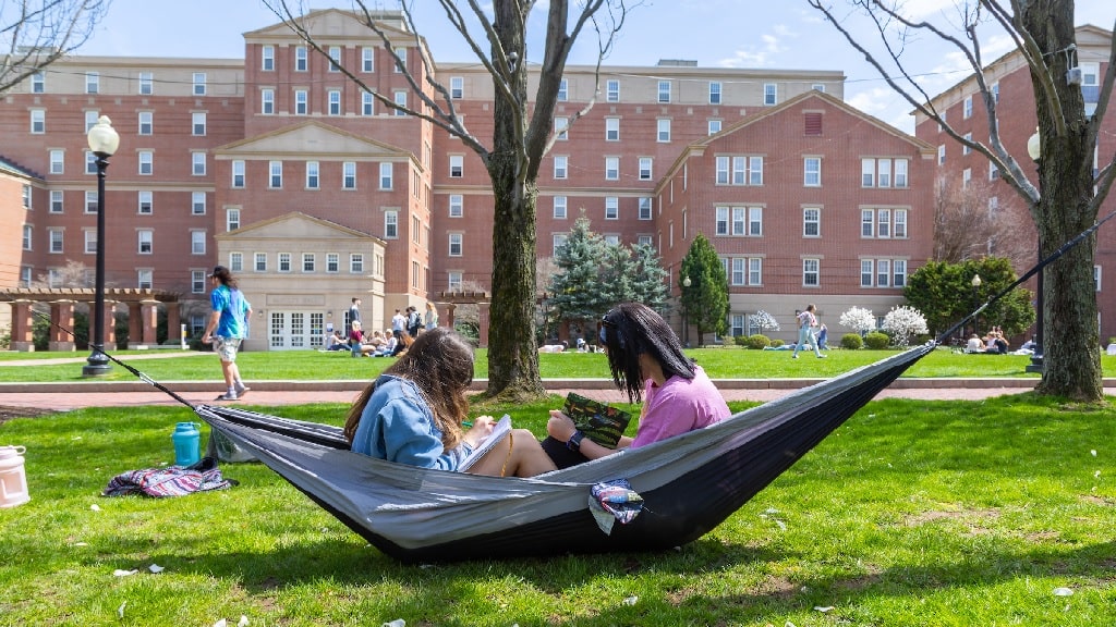two students in a hammock