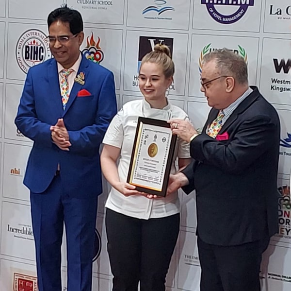 Chantelle Gonsalves Being Presented with the Top 10 Plaque at the Young Chef Olympiad.