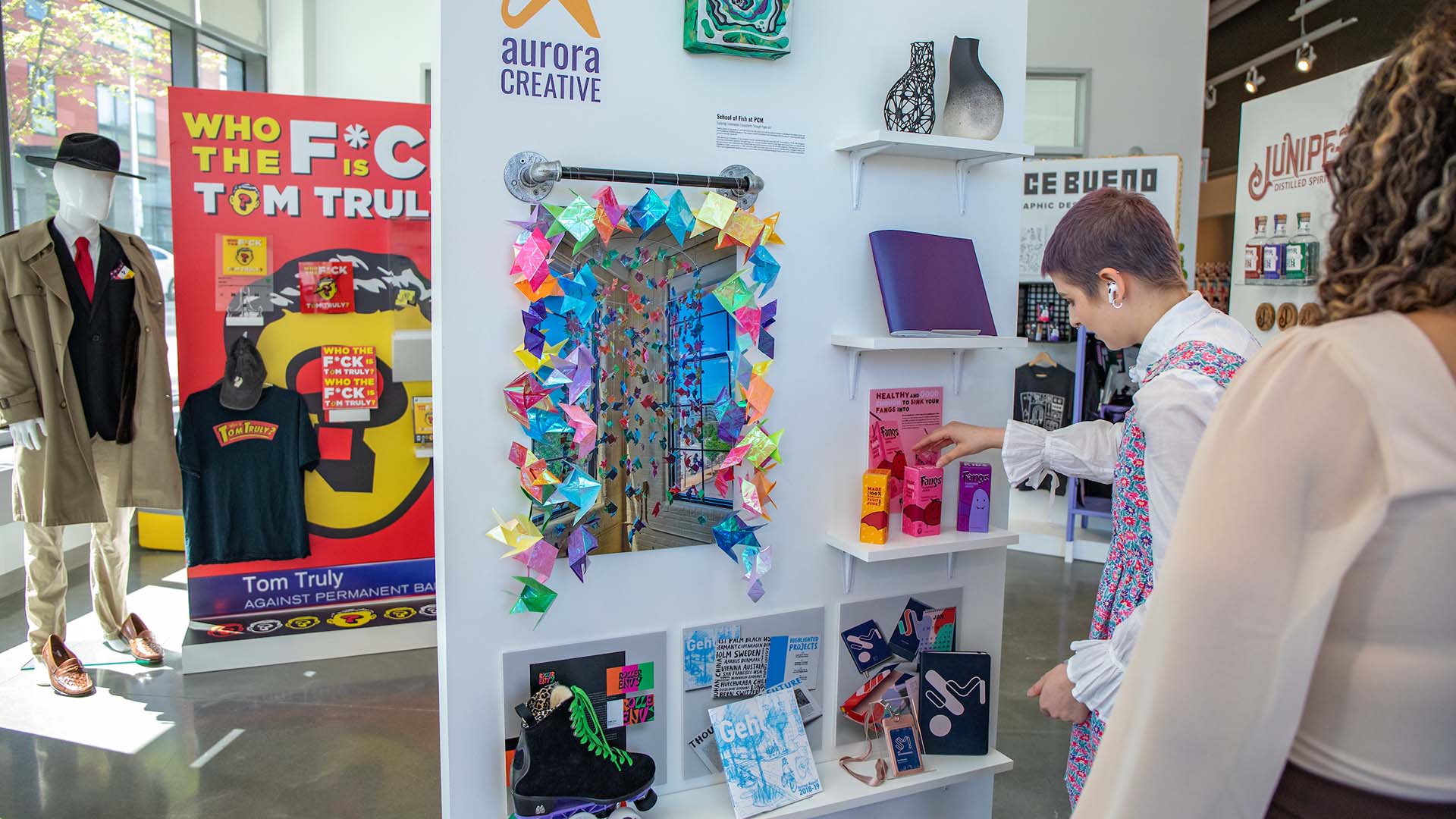 A student looking at a graphic design display