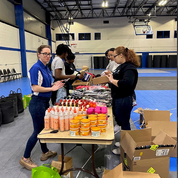 JWU Serves volunteers organizing materials for donations.