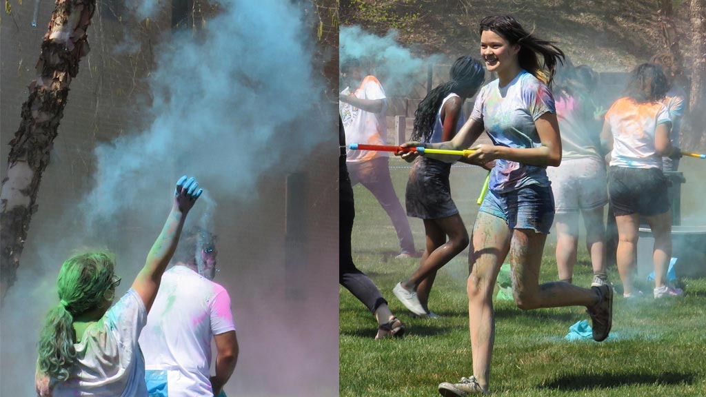 Students clean off colored at Holi 