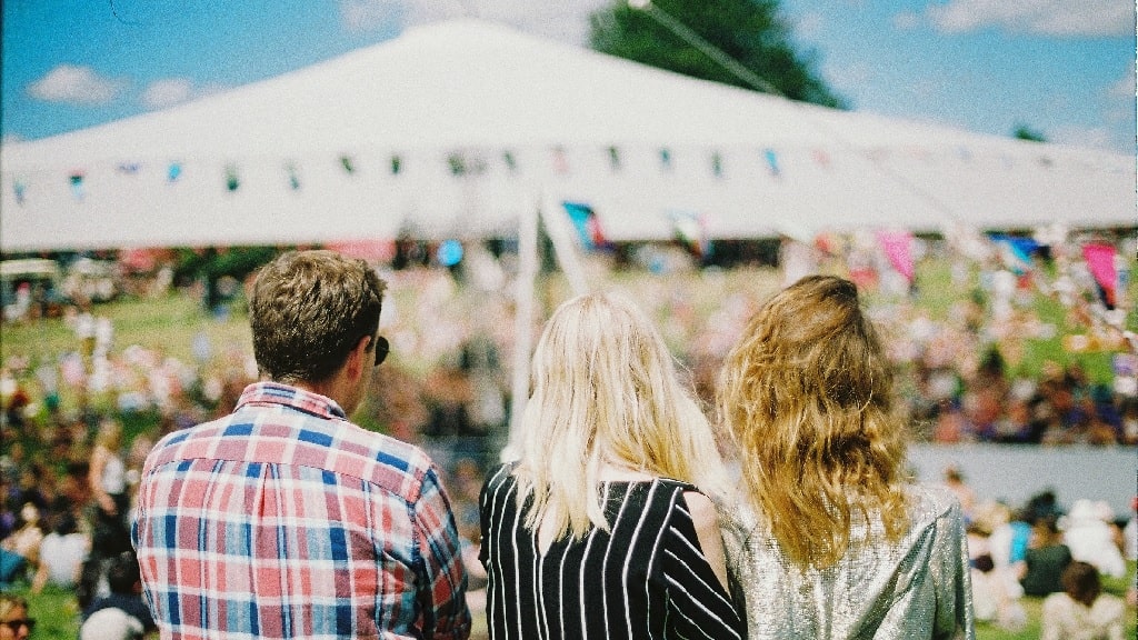 two girls and a boy enjoying a festival