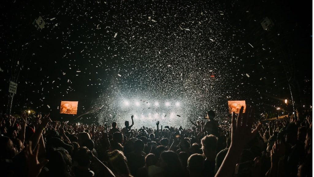 a music concert with confetti in the sky