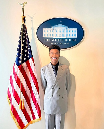 JWU student standing in front of American flag at the White House