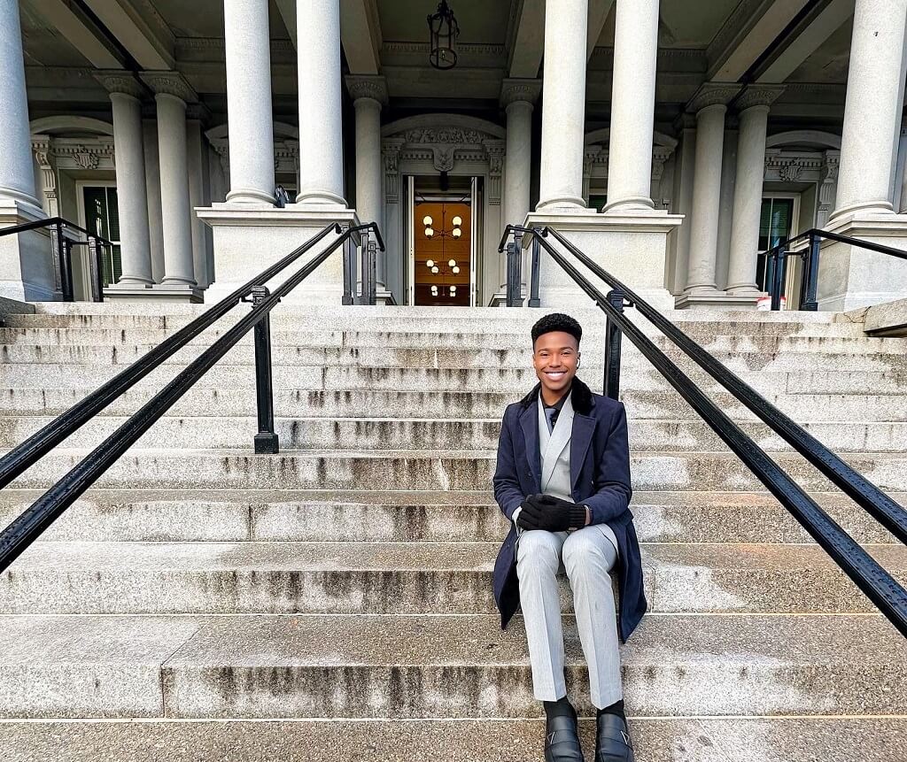 JWU student sitting on steps of the White House