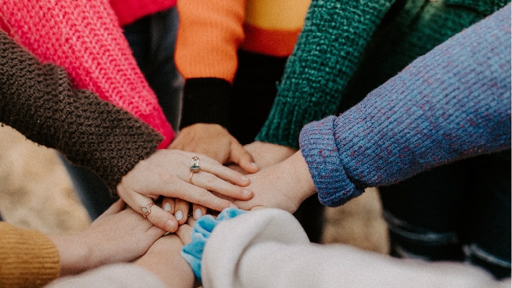 people doing a hand pile