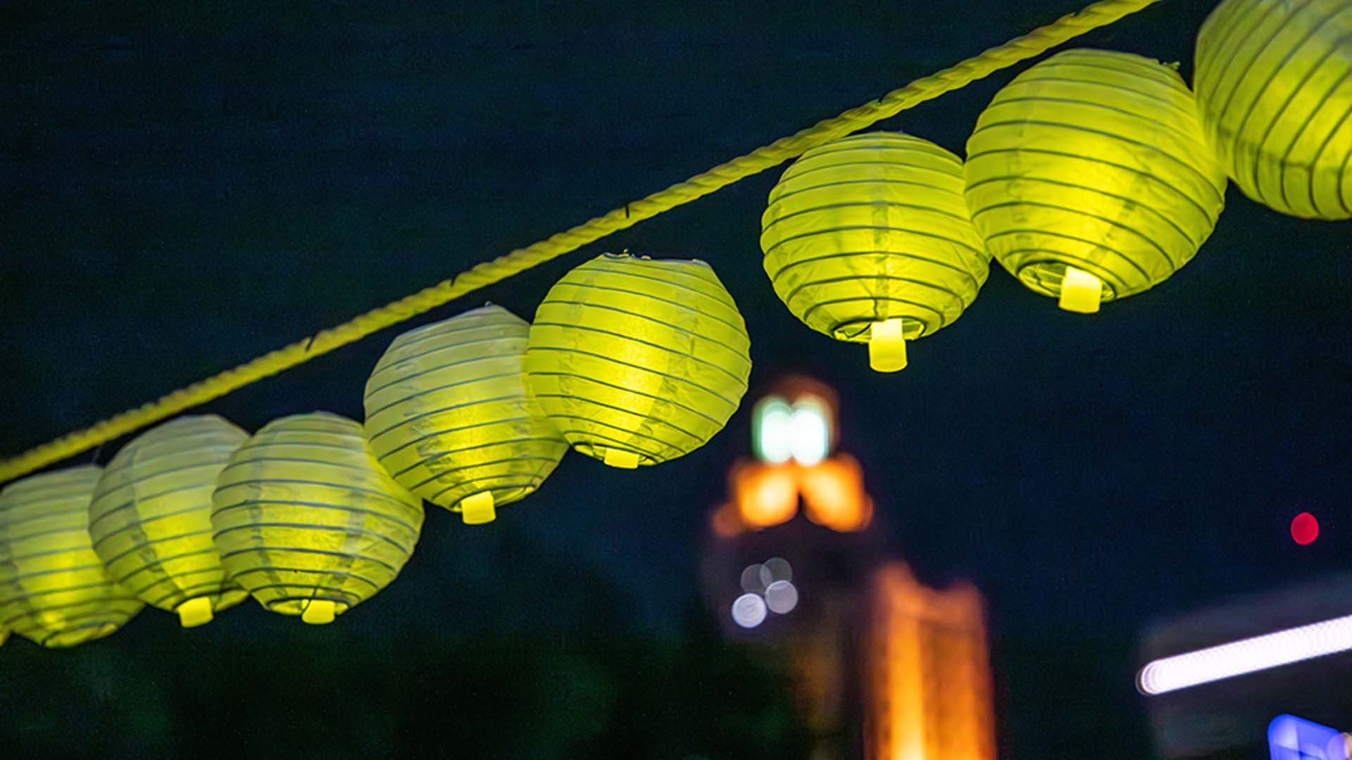 A close up lanterns hanging on a rope