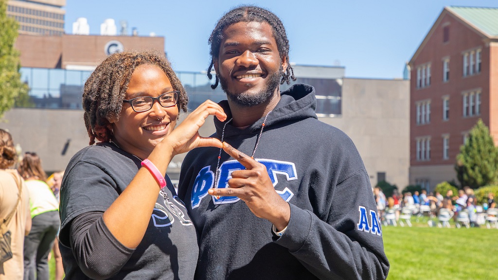 male and female college students in sorority and fraternity apparel