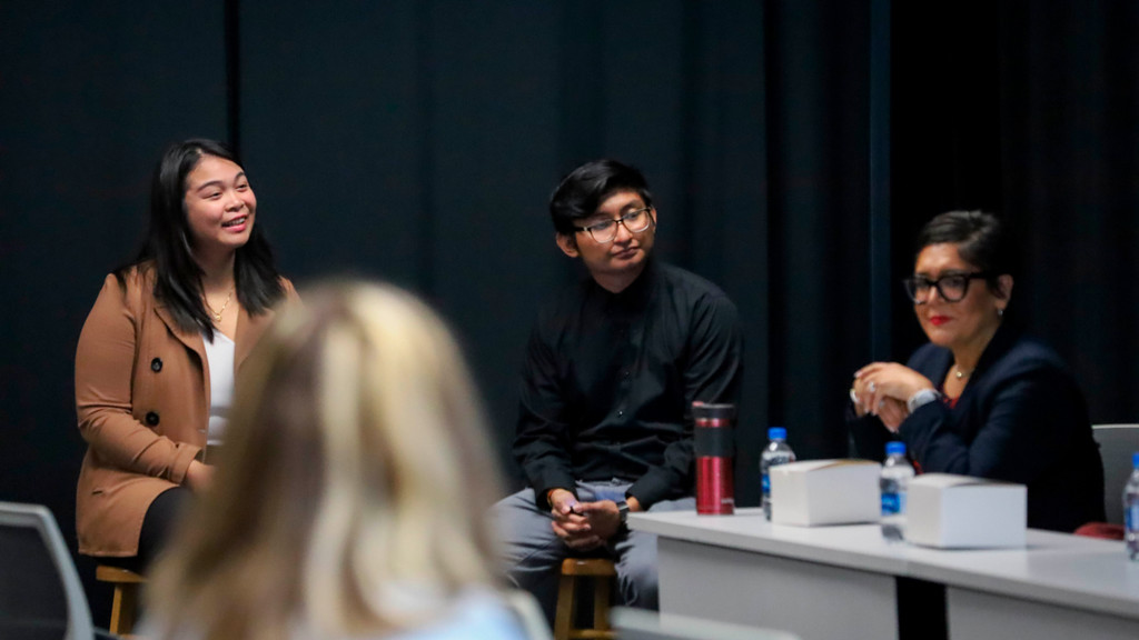 Hillary Thilavong '23 and Aaaron Auguilar '24 sit together to co-moderate the panel.