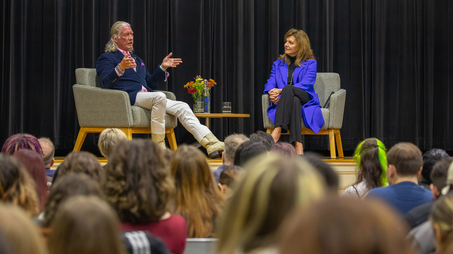 photo of John Hazen White, Jr. and JWU Providence Campus President Marie Bernardo-Sousa on stage during a VIP speaker series event