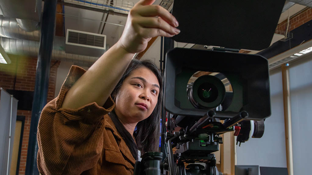 Hillary Thilavon '23 operates a camera in the Center for Media Production