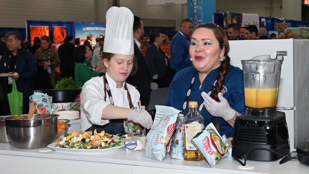 JWU student Brianna Pinder assists Chef Jessica Pamonicutt of Ketapanen Kitchen.