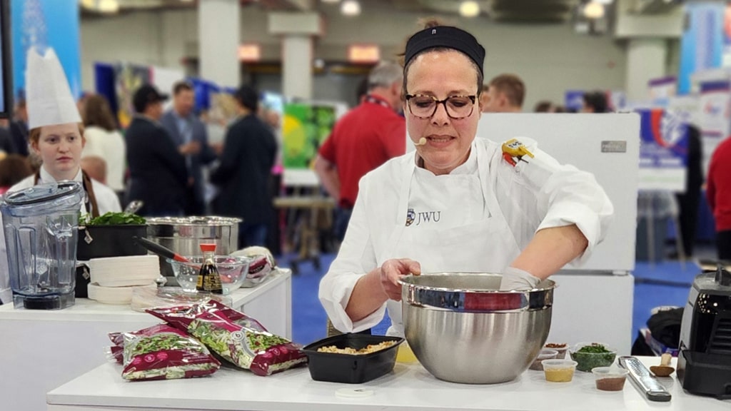 Associate Professor Daina Soto-Sellers demonstrates how to make mushroom “crabcakes” during her NY Produce Show demo.