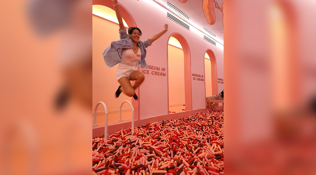 Student jumping into sprinkles pit at the Museum of Ice Cream