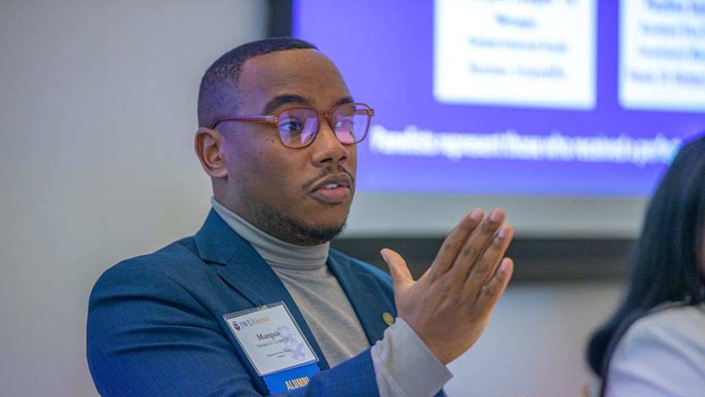 action shot of Marquis Cooper '14 speaking on the DEIB alumni panel