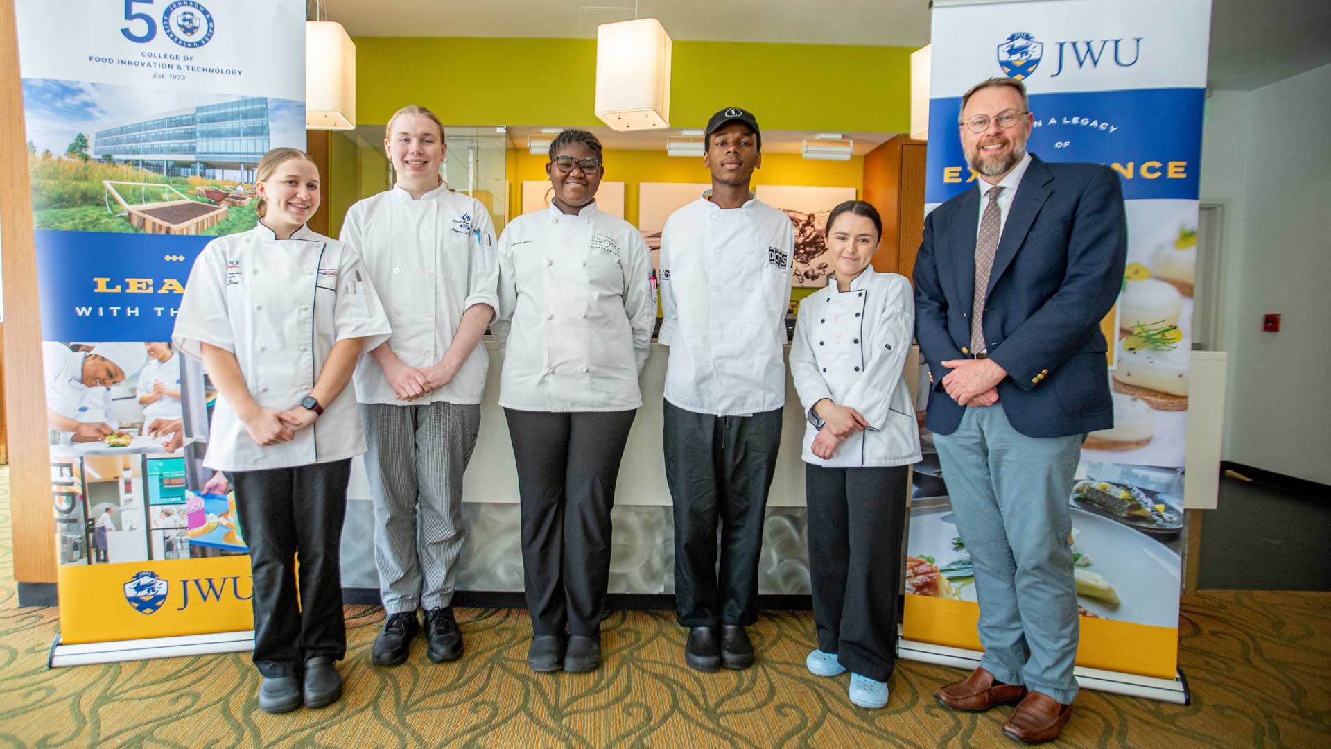 a banner photo of the five Future Food Competition finalists posing with CFIT Dean Jason Evans