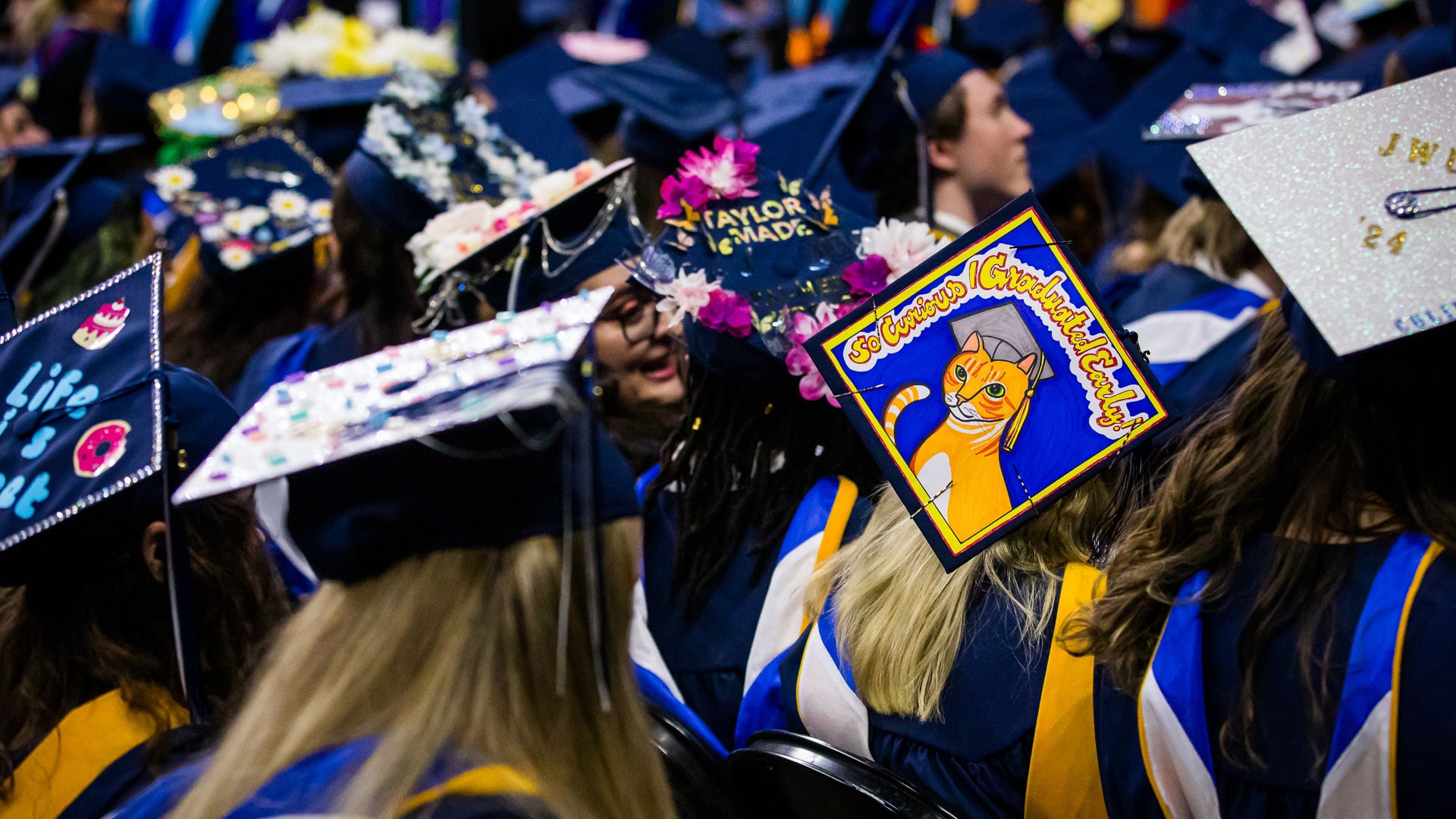 Colorful, customized mortarboards at JWU Providence Commencement.