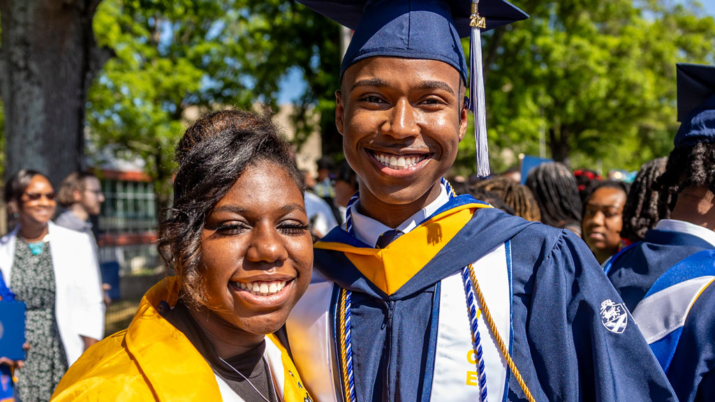 Alijah Jameson '24 poses with his mother at Charlotte Commencement.