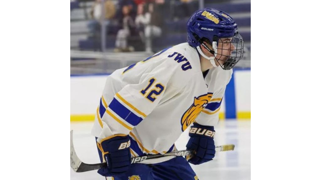 photo of Davis Bone '26 playing hockey in his JWU uniform