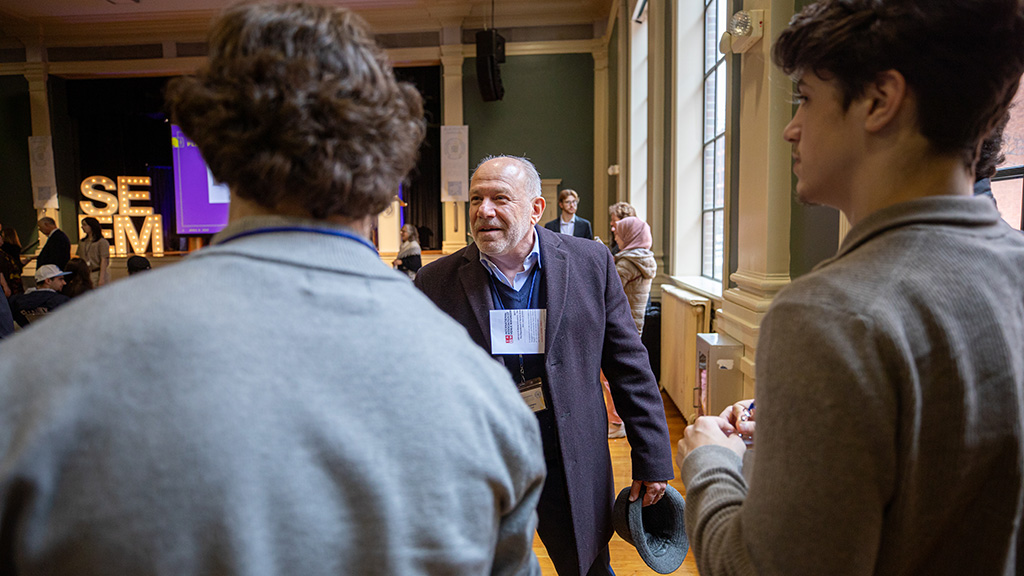 Professor helping students