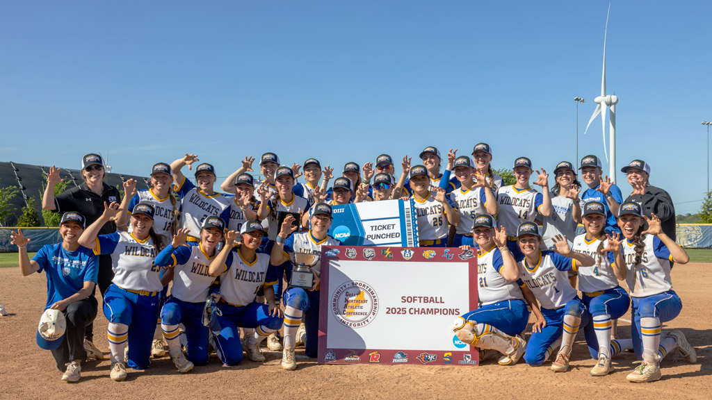 photo of JWU women's softball after their GNAC win in 2025