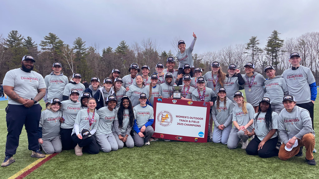 photo of JWU women's track & field after their 2025 GNAC win
