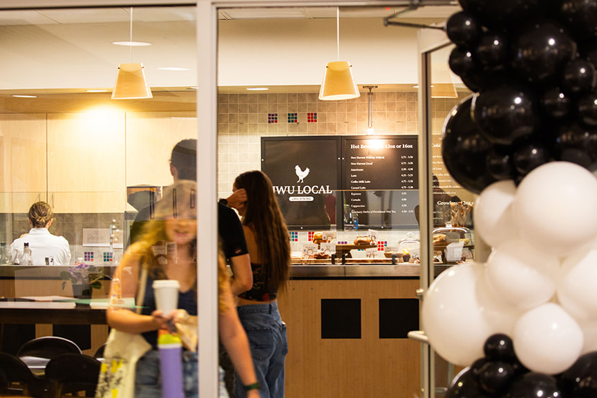 Students wait in line to order food at JWU Local