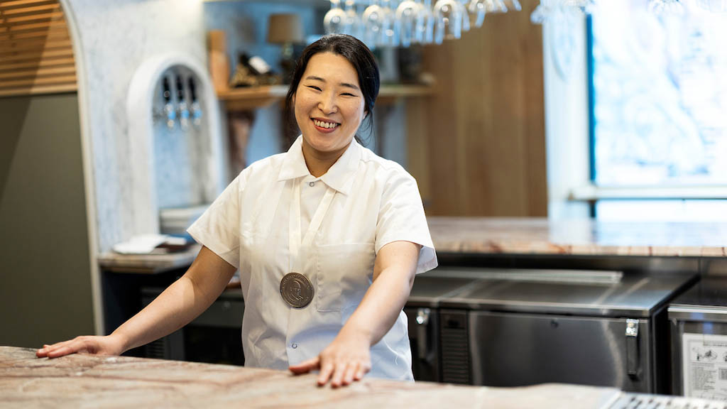 Sky Haneul Kim smiles with her James Beard award for Best Chef: Northeast at Gift Horse.