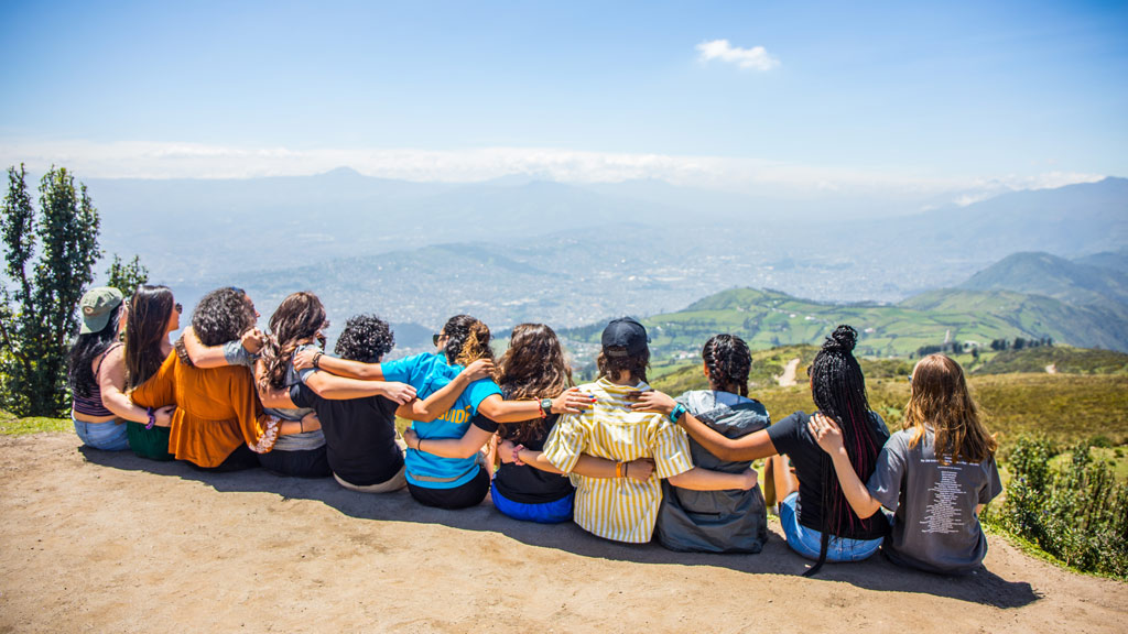 a photo taken from behind of JWU students abroad in Ecuador
