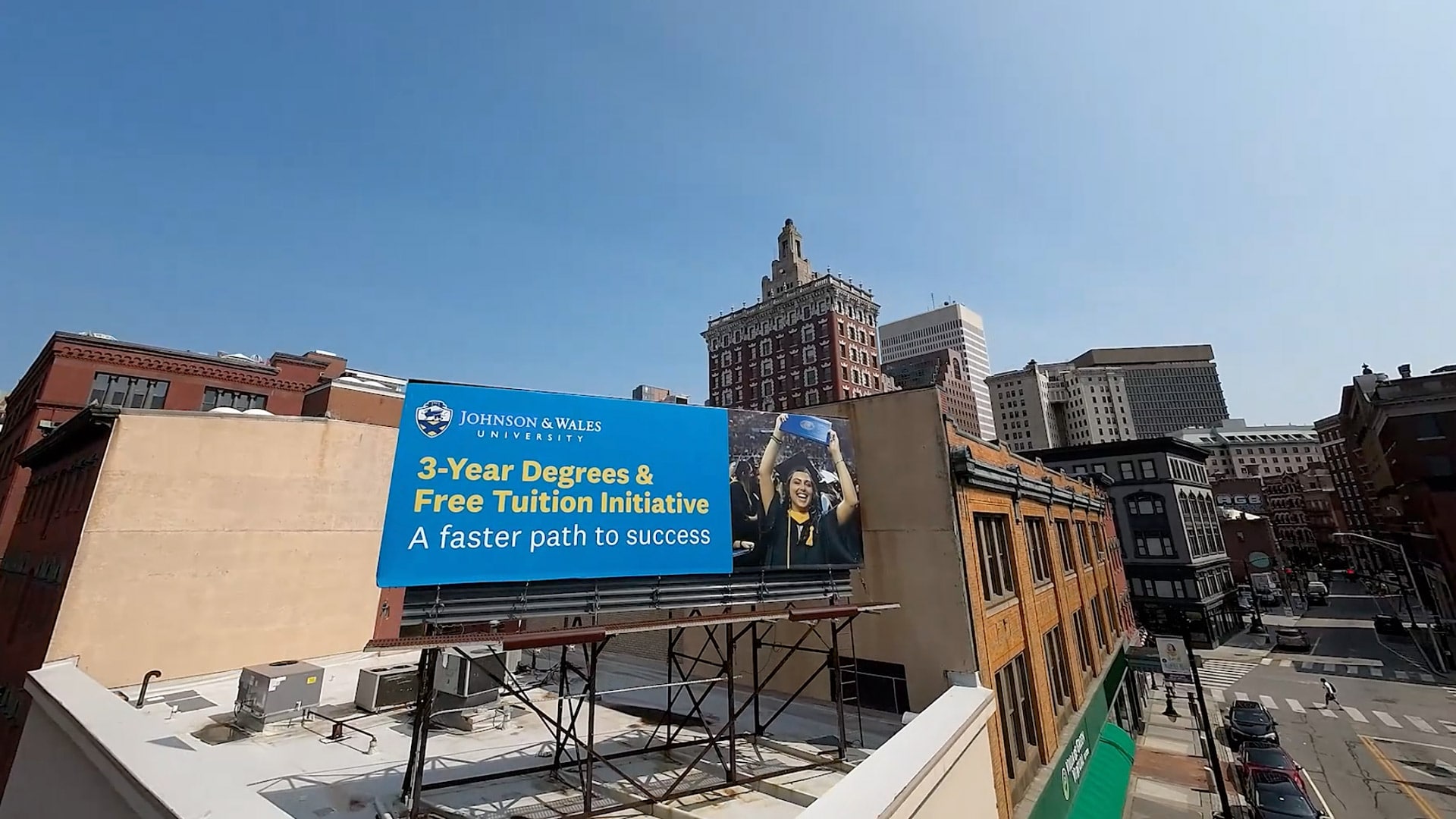 an aerial photo of a JWU banner by the Providence Campus