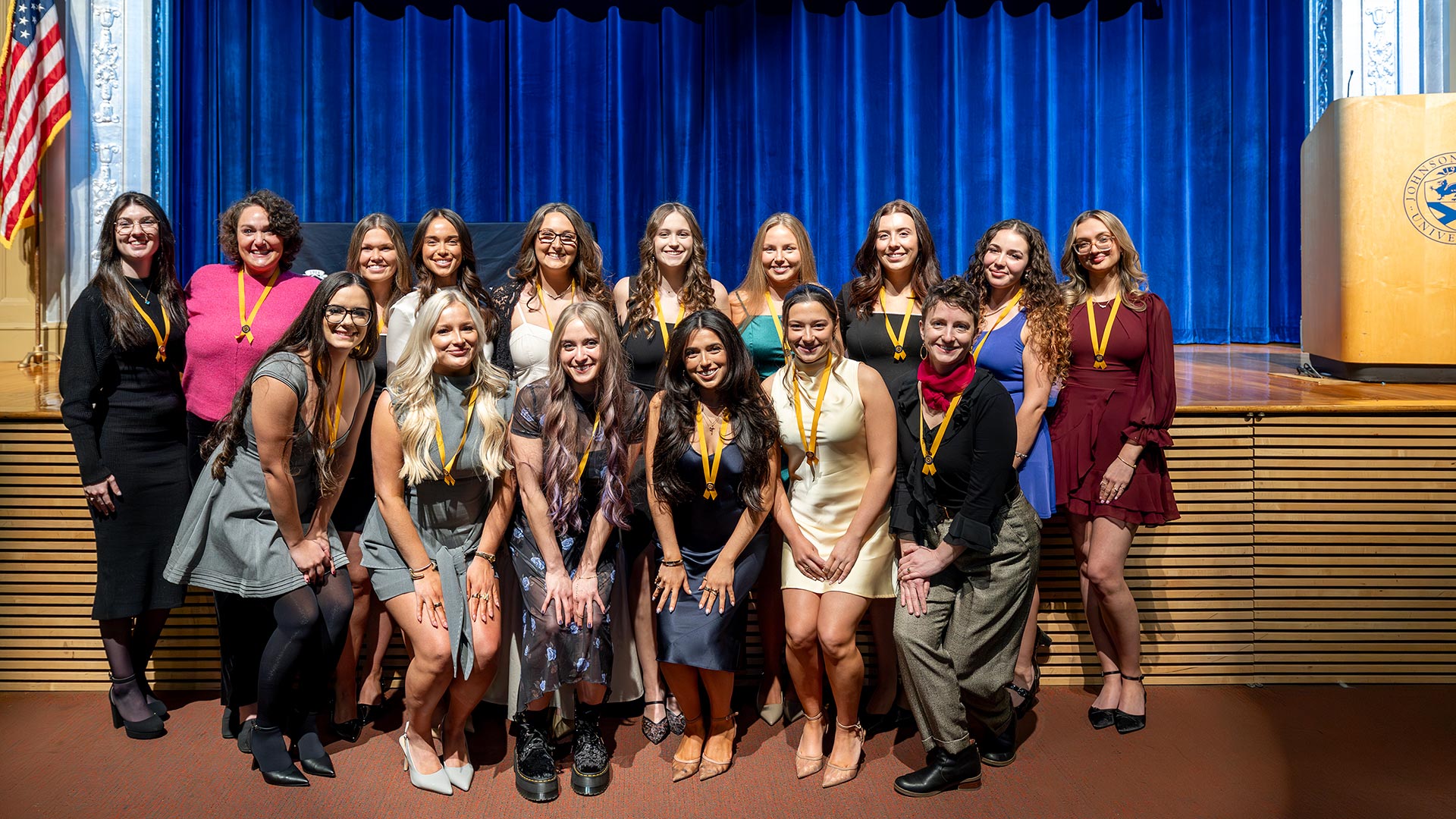 a group photo of the members of the second graduating cohort of JWU's ABSN program