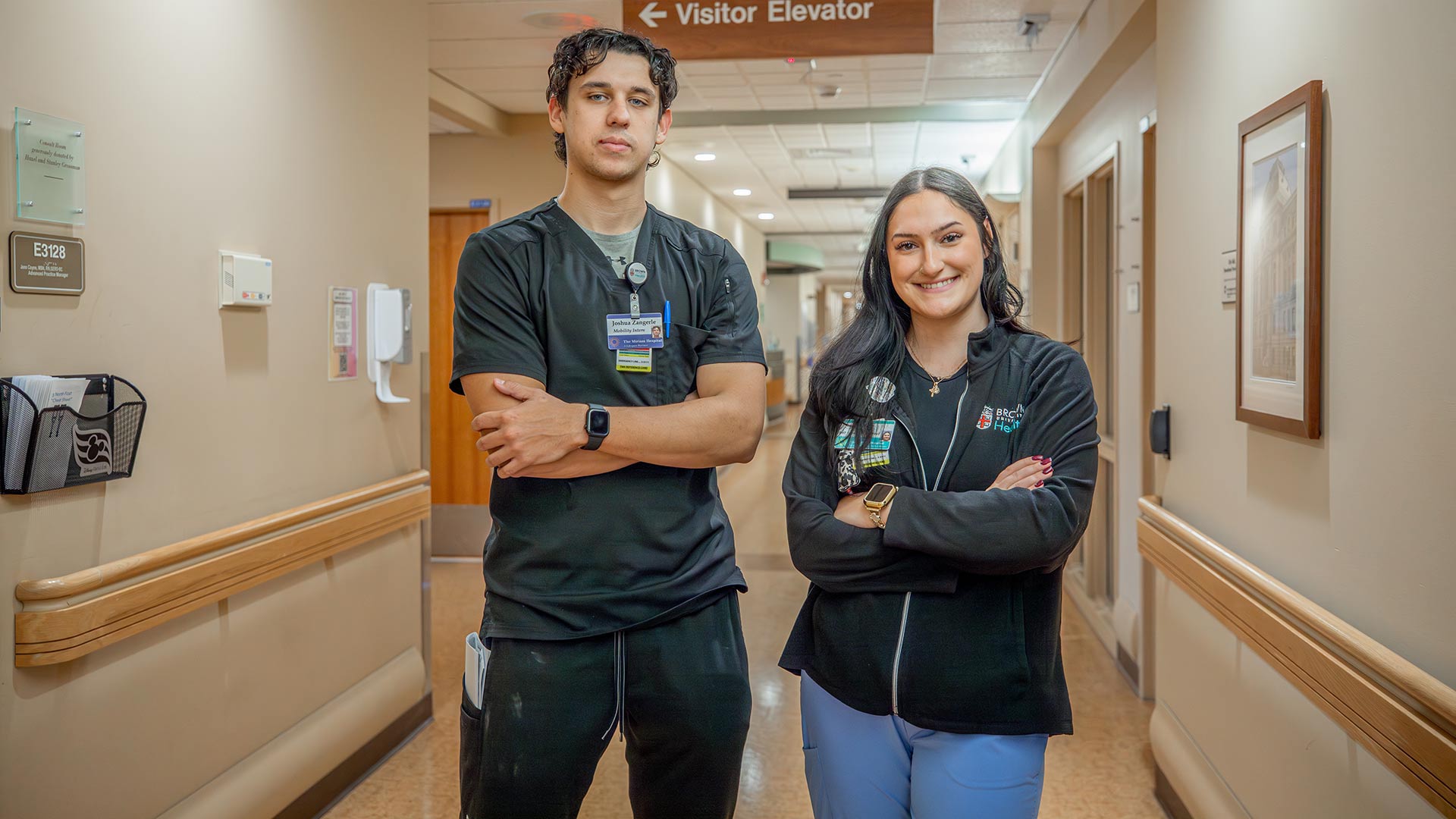 photo of Josh Zangerle '25 and Aria Coutu '26 posing at their hospital internship