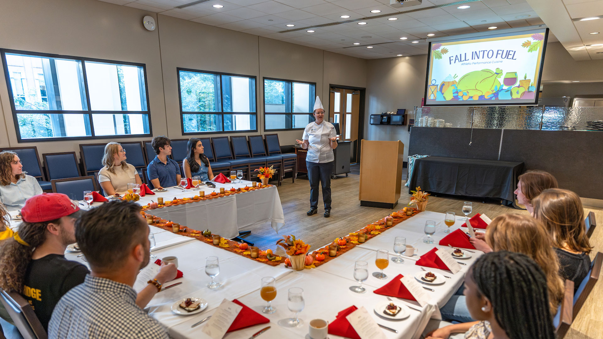 Associate Professor Genny Komar introduces the Fall into Fuel menu at JWU Charlotte.
