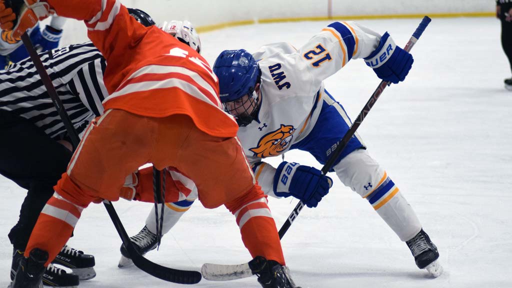 Davis in the faceoff with opposing team player